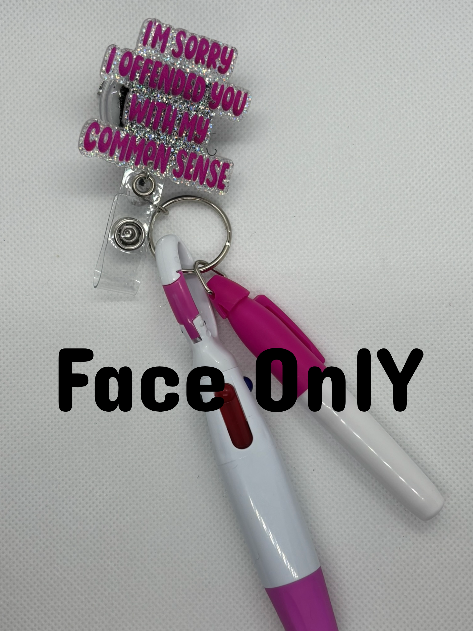 Pink “Common Sense” Badge Face