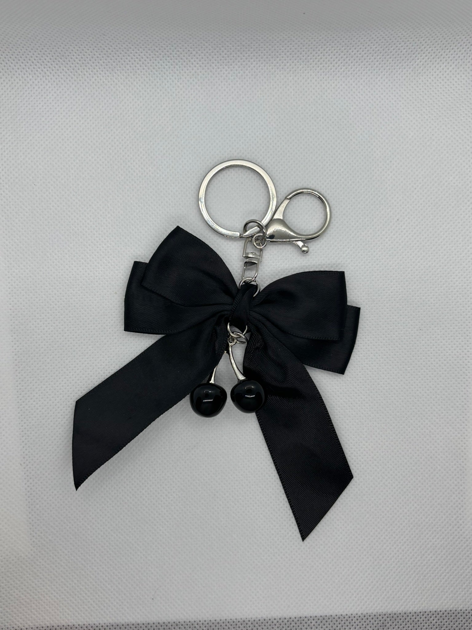 BLACK BOW AND CHERRY KEYCHAIN